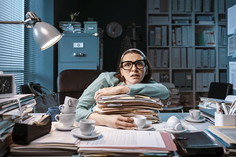 Stressed-employee-working-late-at-night